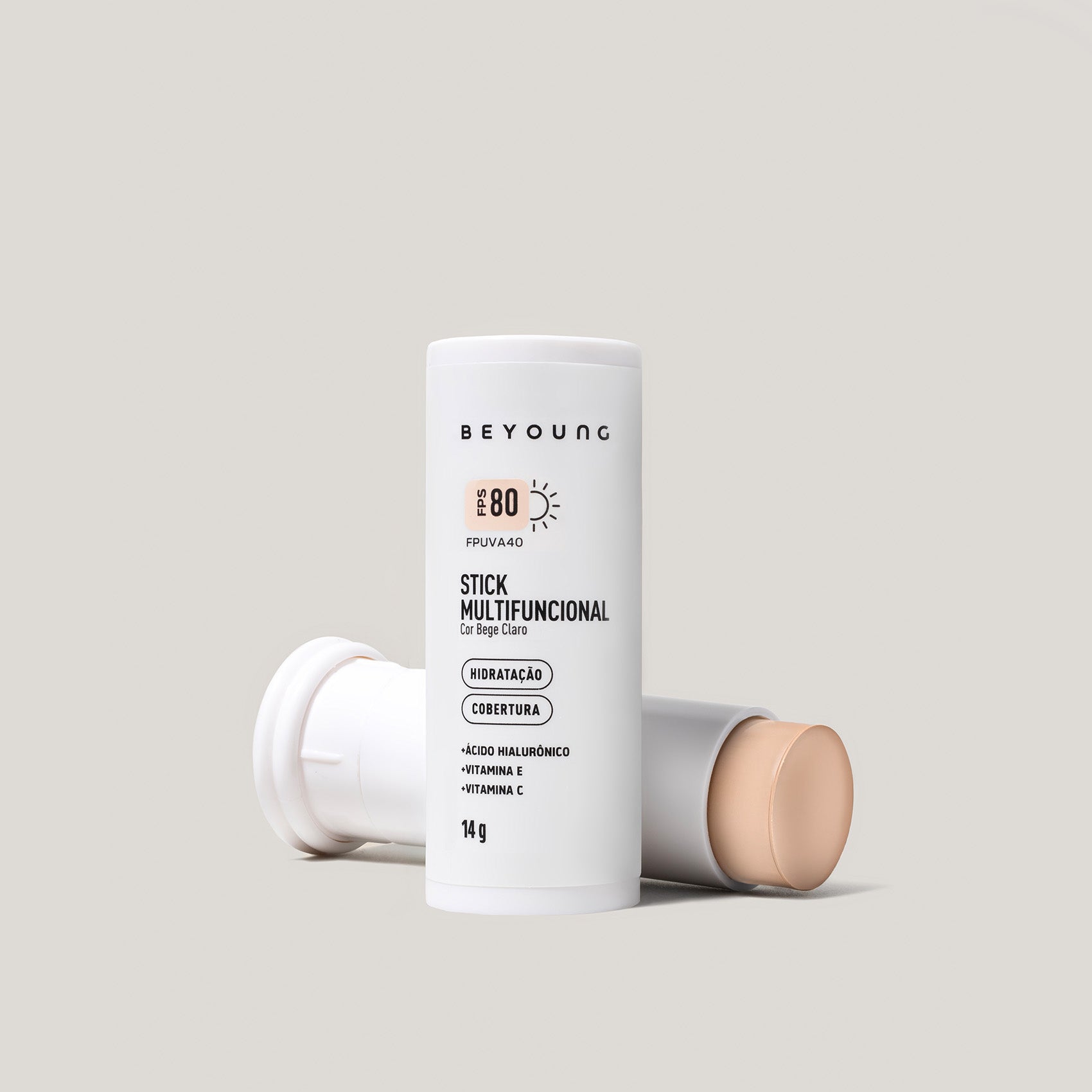 Stick Multifuncional Beyoung FPS 80 cor bege claro em embalagem branca, com ácido hialurônico, vitamina E e vitamina C.